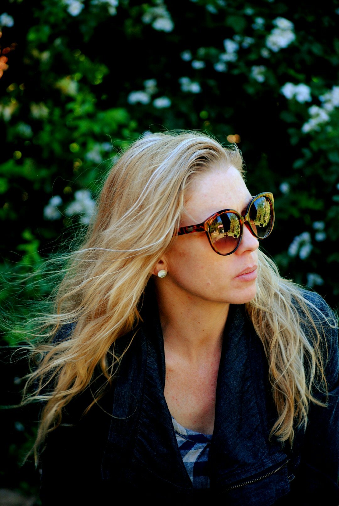 Studio portrait of a young Danish female journalist with blonde hair in a beige blazer